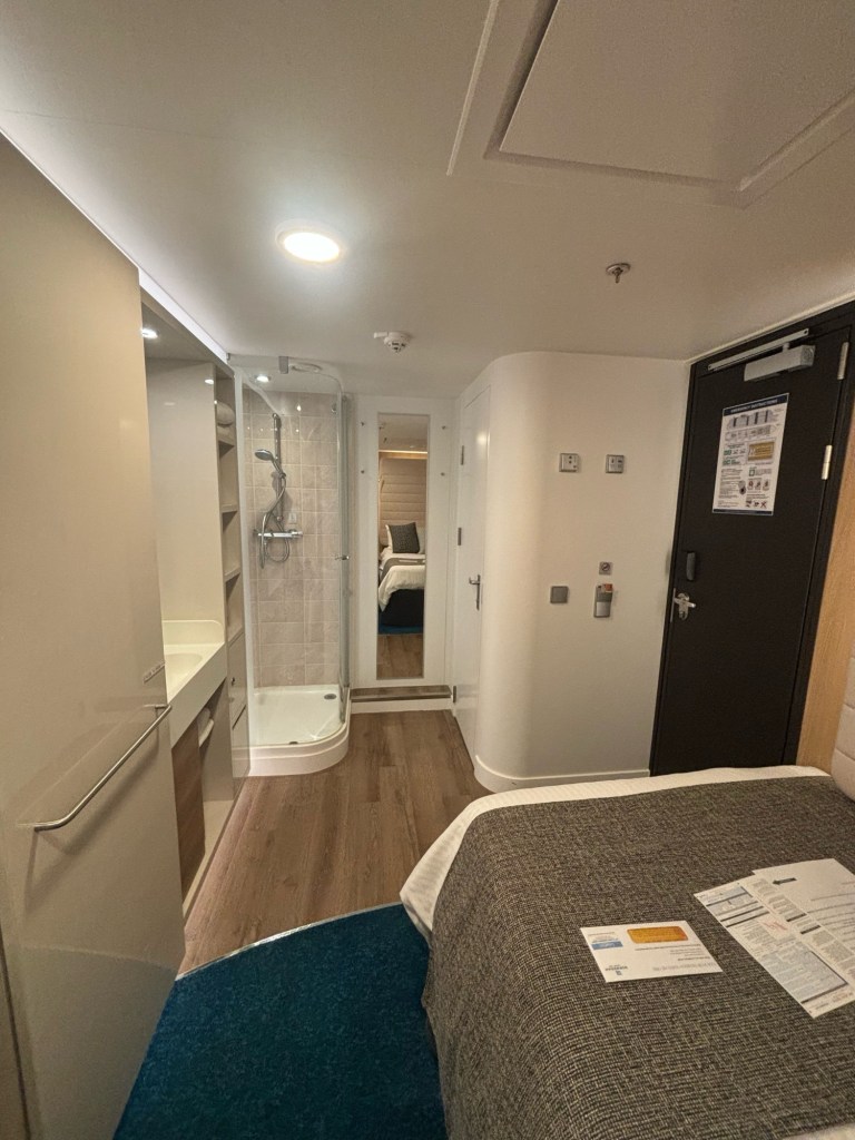 Solo cabin on Norwegian Bliss including the shower and bathroom