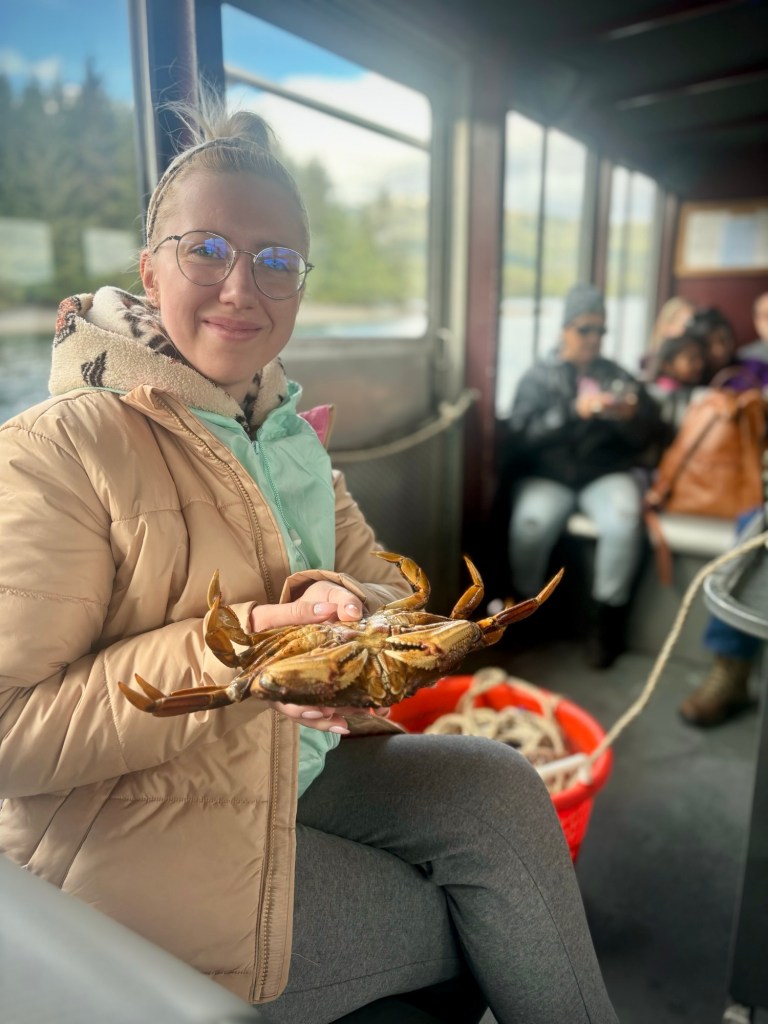 Selfie holding a Dungeness Crab